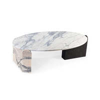 Table basse minimaliste en marbre sculpté, plateau elliptique, pieds en pierre taillée, pièce maîtresse pour la maison
