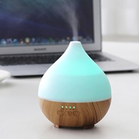 Diffuseur d'arômes et humidificateur Whisper USB à effet bois, brume apaisante pour bureau calme et étagère d'angle de lecture