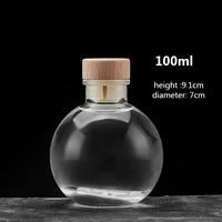 Transparante ronde glazen flesje voor wijn, likeur, brandewijn, sap, drank of fruitwijn met kurk of glazen deksel, 100ml