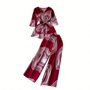 Ensemble décontracté 2 pièces pour femme : Tunique sans manches à col en V et jupe tissée imprimée taille haute, respirant et écologique pour l'été - Product Image 5