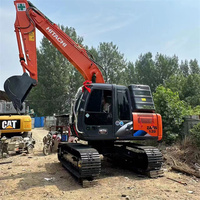 Excavatrice sur chenilles Hitachi ZX 120 d'occasion en bon état avec garantie de qualité de 2 ans et poids de 12 tonnes