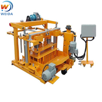 Petite machine mobile hydraulique vibrante à boîte de vitesses automatique pour la fabrication de briques en ciment, béton et cendres volantes