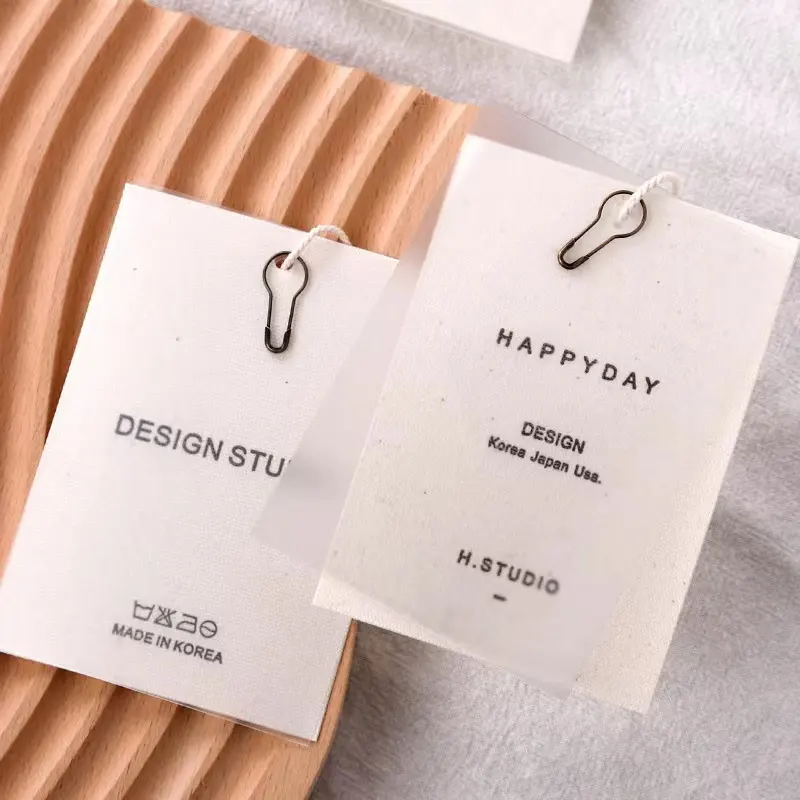 Best Selling Custom Own Brand Embossed Logo clothing accessories paper hang tags for Garment