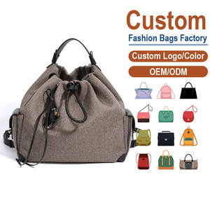 Mochila de Cuero Genuino de Primera Calidad y Lino – Cuerpo de Lona Color Taupe con Detalles de Cuero Negro y Cierre de Cordón Ajustable - Product Image 1