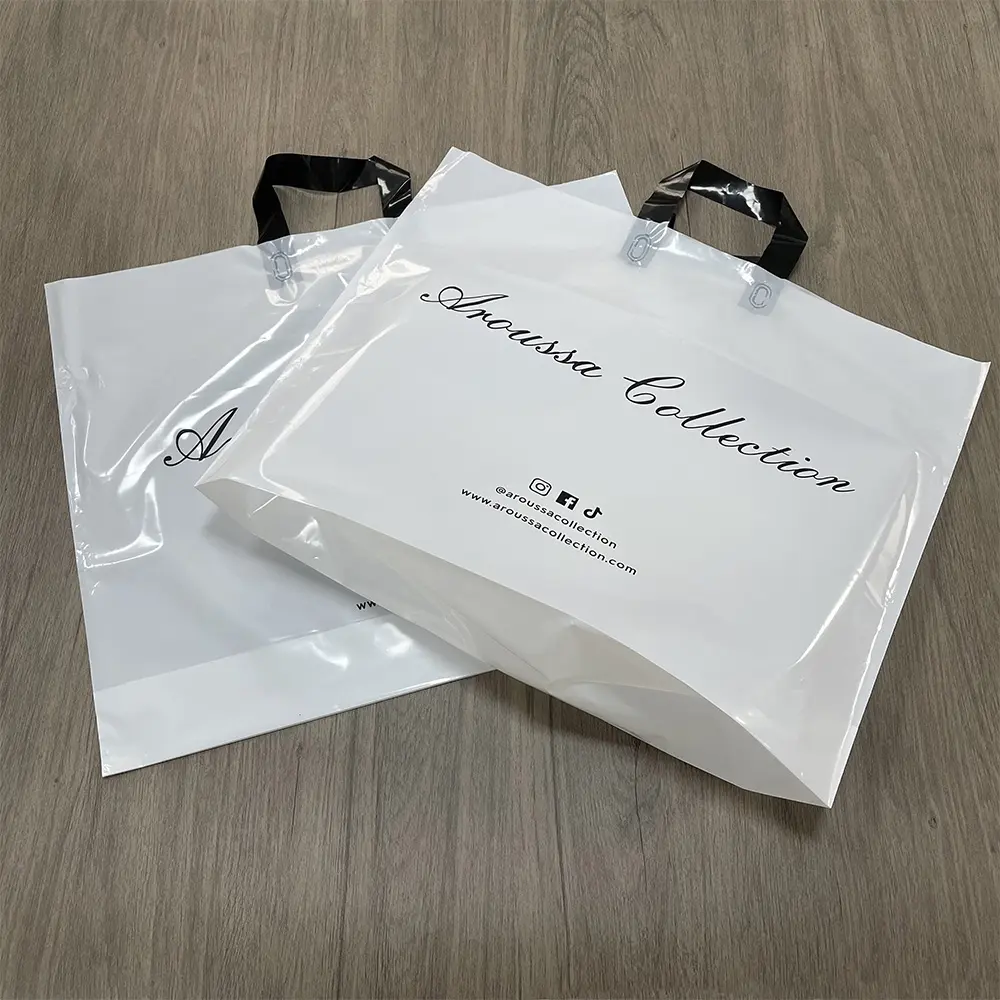 Custom Logo Printed plastic die cut shopping loop carry bags /carrier bags /merchandise bag for boutique