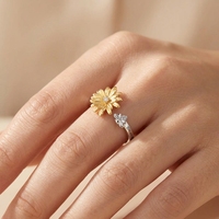 Bague tendance rotative Daisy en laiton plaqué or 18 carats, plaqué or rose, plaqué rhodium, argent 925 pour femme, idéale au quotidien