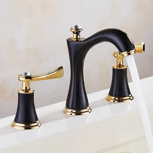 Lavabo de baño Grifo negro y dorado Grifo de latón Grifo moderno de lavabo de mano de tres orificios Mezclador de agua de una manija Grifo de agua fría y caliente
