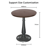 Table d'appoint ronde en bois de style industriel classique, base en fonte sculptée motif soleil pour les aménagements de cafés