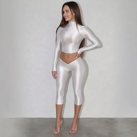 Ensemble 2 pièces brillant uni pour femme : T-shirts à col roulé et manches longues, crop tops + pantalon moulant taille basse à coupe en V longueur mollet, tenues de ville