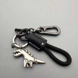 Porte-clés dinosaure tendance en alliage de zinc T-Rex, pendentif de sac à dos, porte-clés multifonctionnel en corde tressée, porte-clés de voiture en métal - Product Image 1
