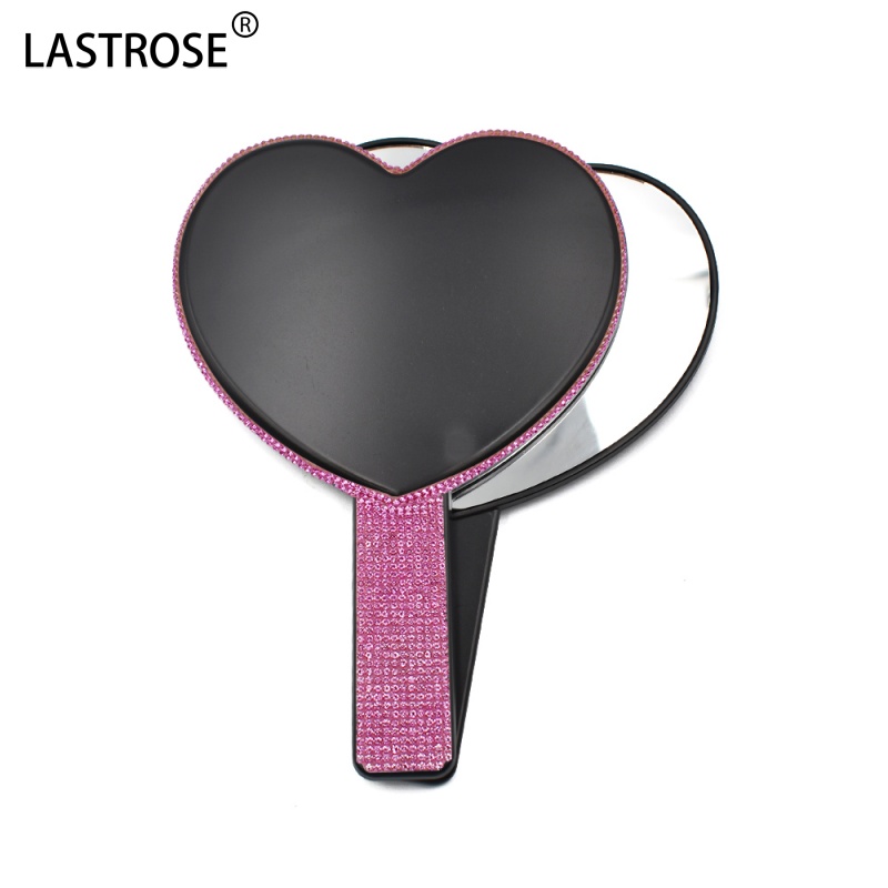 Miroir à cœur noir avec diamant rose vif