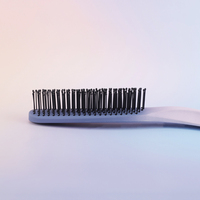Brosse démêlante en nylon en forme de S avec coussin et ventilation pour cheveux secs