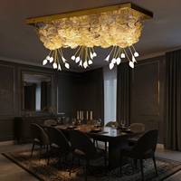 Lustre rectangulaire moderne de luxe côtier avec cadre en acier inoxydable et pétales en cristal pour hôtel, salon et salle à manger