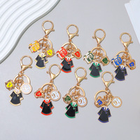 Porte-clés en métal pour l'école de sorcellerie de Harry Potter, cadeau commémoratif, pendentif livre magique, badge pour étudiants et diplômés