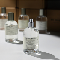 Vente en gros de flacons de parfum de luxe en verre cylindriques vides de 30 ml, 50 ml, 100 ml avec impression sérigraphique et pulvérisateur à pompe
