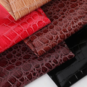 Guangzhou Pvc Leder Stoff Hersteller 0,6mm dicke Strick basis Hochglanz Stein muster Kunstleder für Taschen gürtel - Product Image 1