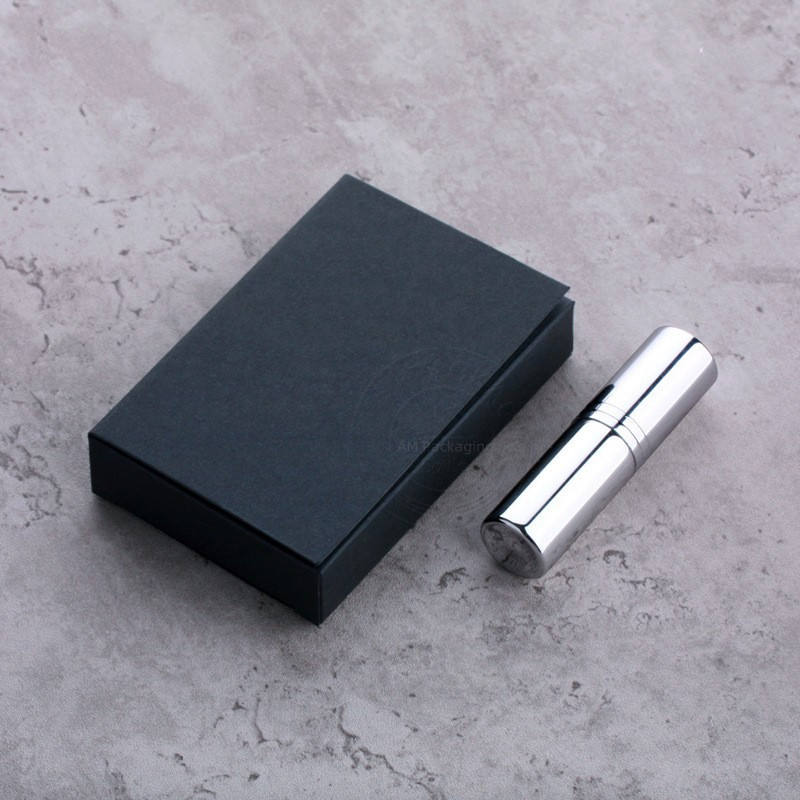Silver perfume spray bottle with black box