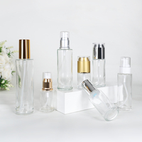 Vente en gros de flacons de lotion pour le corps en verre transparent de 100 ml, 120 ml et 30 ml avec pompe en plastique rose pour l'emballage des soins de la peau
