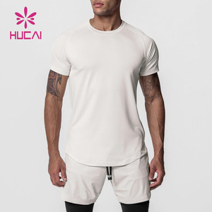 Logo personnalisé incurvé ourlet fendu Spandex séchage rapide musculaire coupe ajustée vêtements de sport t-shirt hommes Fitness course Compression chemises de gymnastique - Product Image 1