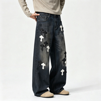 Jeans amples à coupe croisée de style américain haut de gamme pour hommes, avec patchs en cuir croisés et motifs brodés