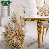 Table à manger serpentine moderne de luxe en acier inoxydable avec plateau en verre pour mariage, hôtel, événements en plein air