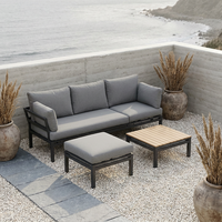 Ensemble de salon de jardin 4 pièces en aluminium noir mat, résistant aux intempéries, avec table basse à lattes en bois et ottoman amovible et imperméable