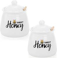 Pot d'abeille à miel en céramique Offre Spéciale couvercle de pot de miel en porcelaine pour le stockage des aliments conception imprimée pour la cuisine à domicile nouveau style de stockage