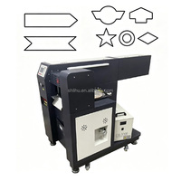 Machine de découpe laser automatique pour sangles avec perforateur de trous motorisé et découpeur de formes pour sangles jacquard, étiquettes, cordes et rubans