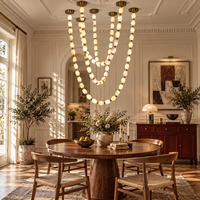 Lustre moderne de luxe en albâtre à anneaux multiples, cadre en laiton, couleur personnalisée pour hall d'hôtel, escalier, plafond haut, projet d'aménagement intérieur