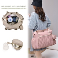 Sac à dos multifonctionnel transfrontalier pour maman et bébé, grande capacité, tendance, en tissu Oxford beige, à suspendre à la poussette