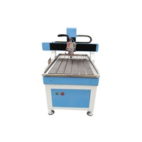 Machine de gravure CNC UBO 6090 1212 Mini avec Nc Studio Mach 3 DSP pour la gravure sur acrylique, bois, PVC, aggloméré