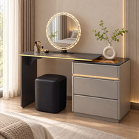Table de toilette pour le maquillage avec miroir rond orné de pierres, panneau en verre noir, tiroirs à bordure dorée pour chambre à coucher, maison et salon de beauté