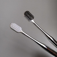 Vente en gros pas cher de haute qualité OEM logo personnalisé maison 144 or rose hôtel brosse à dents manuelle à poils souples Ultrasoft