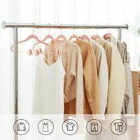Cintres en velours avec pinces, crochet or rose, simple niveau, pour organisation de placards et de salles de bain, présentation en boutique