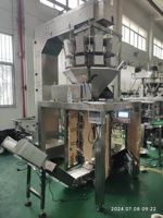 Machine d'emballage verticale VFFS pour aliments surgelés, raviolis, snacks de riz, noix, arachides, graines, avec peseuse multi-têtes