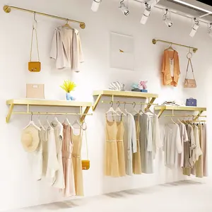 Lady Boutique Store Furniture Wall Mounted Metal Clothing Display Rack Gold Stainless Steel Clothes Stand For Garment Shop