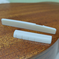 Set Bridge Gitar Folk YMH dari Tulang Sapi Asli dengan Kemasan dalam Kantong