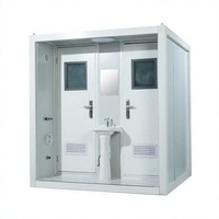 Cabine de toilettes portable blanche à double porte avec lavabo central pour les installations extérieures