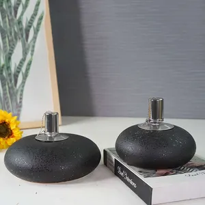 Diskon besar modern botol bulat hitam mewah pembakar minyak keramik lampu sumbu grosir pembakar minyak aromatik untuk minyak wangi