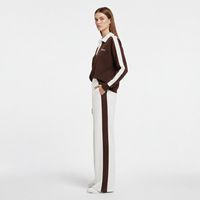 Ensemble de survêtement pour femme à manches courtes, veste courte zippée, pantalon de survêtement à jambes larges avec rayures latérales et boutons-pression, vente en gros