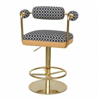 Tabouret de comptoir pivotant de luxe en ambre tressé avec assise rembourrée épaisse, base ronde à poteaux dorés et anneau à rayons, pour coin whisky