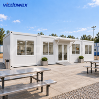 VICDOWEX Maison Conteneur Modulaire Préfabriquée Portable à Montage Rapide Design Contemporain pour Bureau de Chantier Éloigné et Dortoir