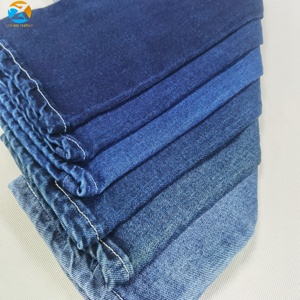 Chất lượng cao tùy chỉnh 9.25oz vải denim thô màu xanh đậm Twill căng cho nam giới/sợi nhuộm slub phong cách chàng trai cô gái cảm thấy bàn tay mềm mại - Product Image 4