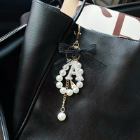 Porte-clés créatif en alliage de zinc avec perles et strass, pendentif de sac, nœud en dentelle tendance, style coréen, avec lettre