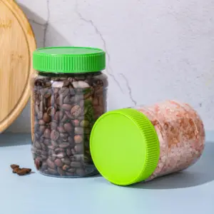 Venta al por mayor 500ml Paquete de mantequilla de maní de plástico botellas de embalaje tarros contenedores para mantequilla de maní con tapas