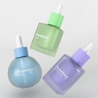 Bouteille en verre dépoli en forme de boule pour huile de visage Flacon compte-gouttes en verre vide de 1oz