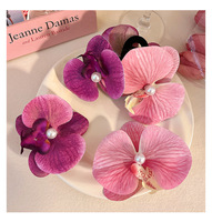 Vente en gros de pinces à cheveux en forme de fleur de phalaenopsis 3D réalistes pour femmes - Pinces à bec de canard en forme d'orchidée pour la plage, les mariages et le quotidien