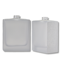 Bouteille en verre de luxe avec conception d'étiquette personnalisée en gros petite bouteille unique en argent clair mat 65ml 50 ml 100 ml bouteille de recharge de parfum en verre