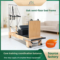 Reformador de Pilates de doble uso de roble con media torre y tabla de salto para sesiones de entrenamiento en pareja y fitness en sala