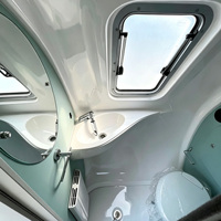 Caravane de style rétro avec cuisine compacte complète et extérieur personnalisé, caravane remorquable à coque arrondie lisse pour les voyages en camping